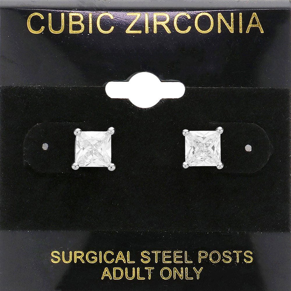 Classic square clear crystal stud earrings in a silver finish with four-prong settings and surgical steel posts, displayed on a black jewelry card.