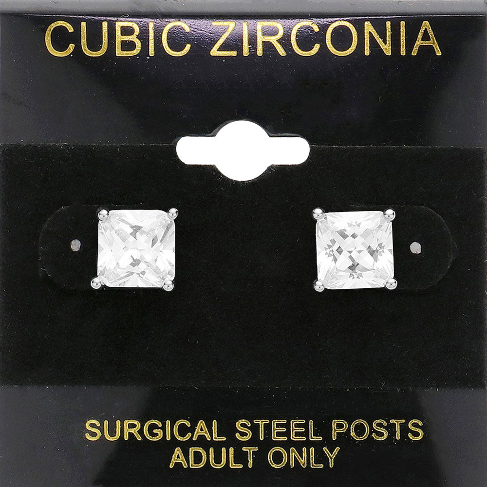 Classic square clear crystal stud earrings in a silver finish with four-prong settings and surgical steel posts, displayed on a black jewelry card.