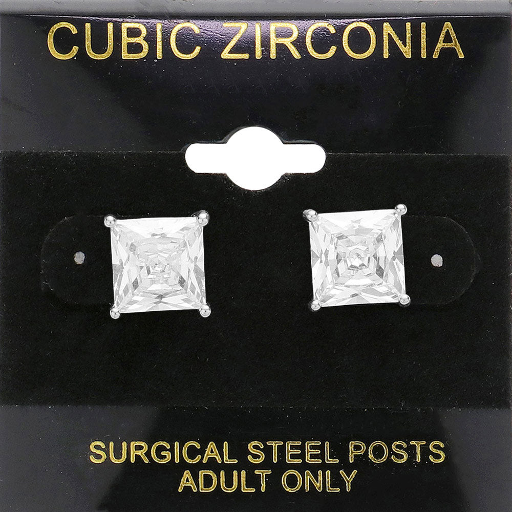Classic square clear crystal stud earrings in a silver finish with four-prong settings and surgical steel posts, displayed on a black jewelry card.