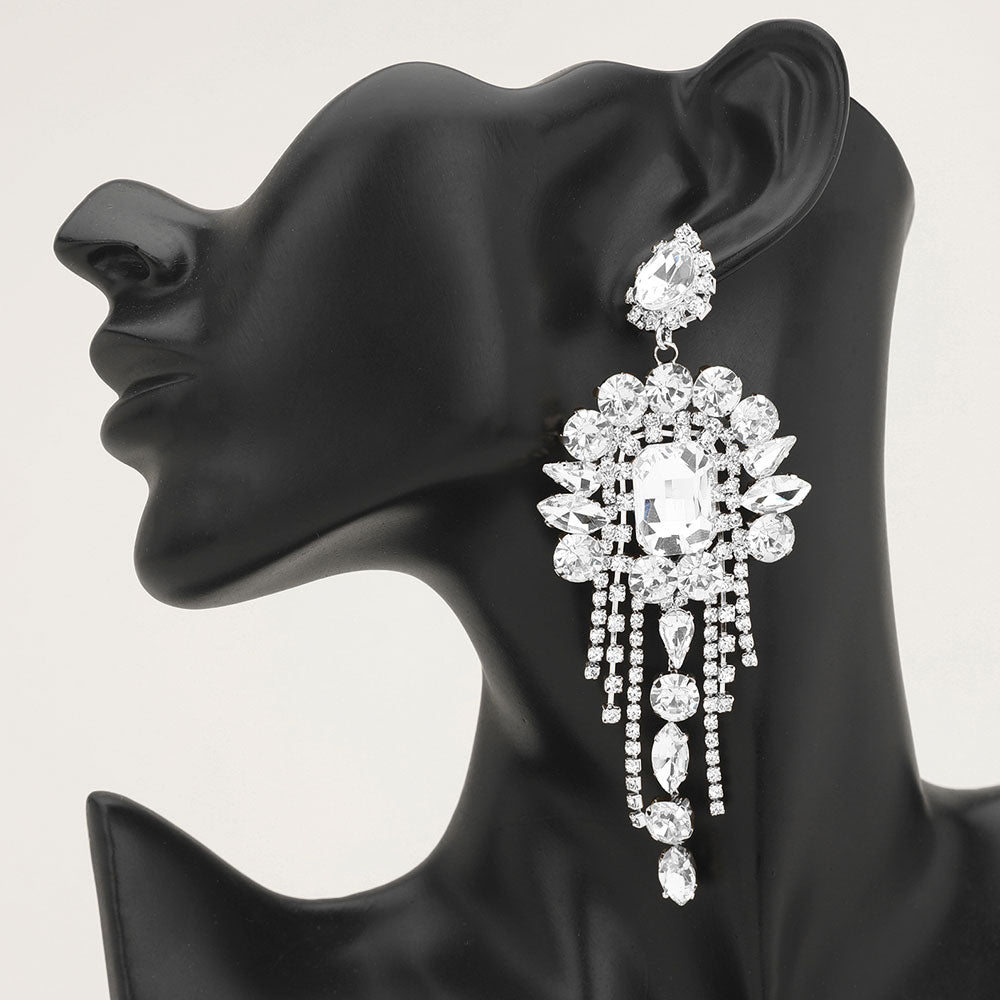 Long 4.6" clear on silver chandelier fringe earrings on a black mannequin ear — dramatic crystal statement jewelry for pageant, prom, weddings, and evening events.