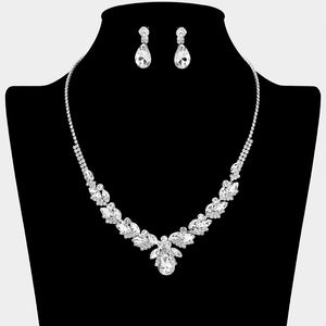 Clear teardrop marquise prom necklace set on silver with matching earrings displayed on a black mannequin bust on a white background.