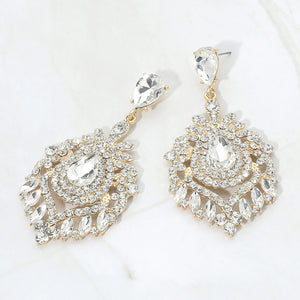 Clear crystal teardrop chandelier statement pageant earrings on gold with an ornate layered crystal design, displayed on a white background.