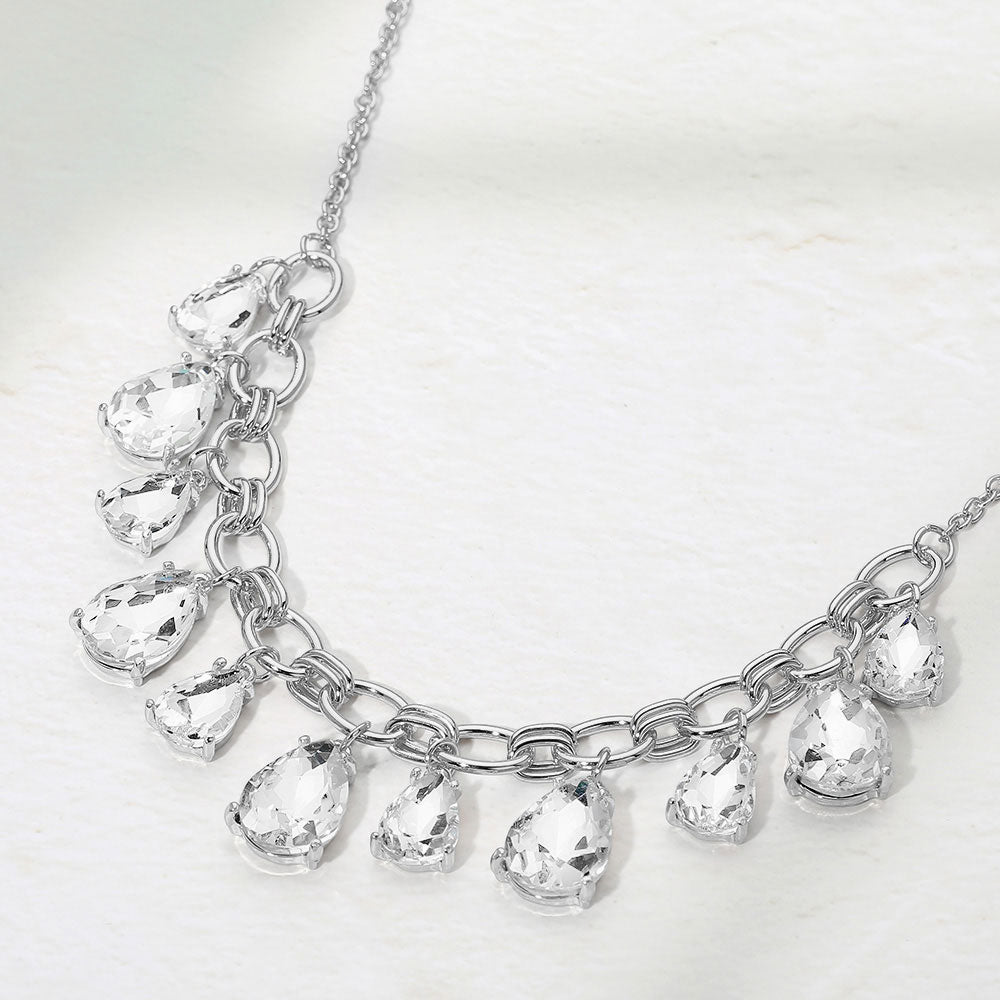 Clear crystal teardrop statement necklace on antique silver on white background