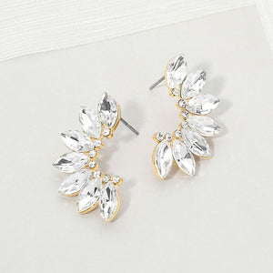 Clear crystal marquise wing-inspired earrings on gold with layered marquise stones, displayed on a white background.