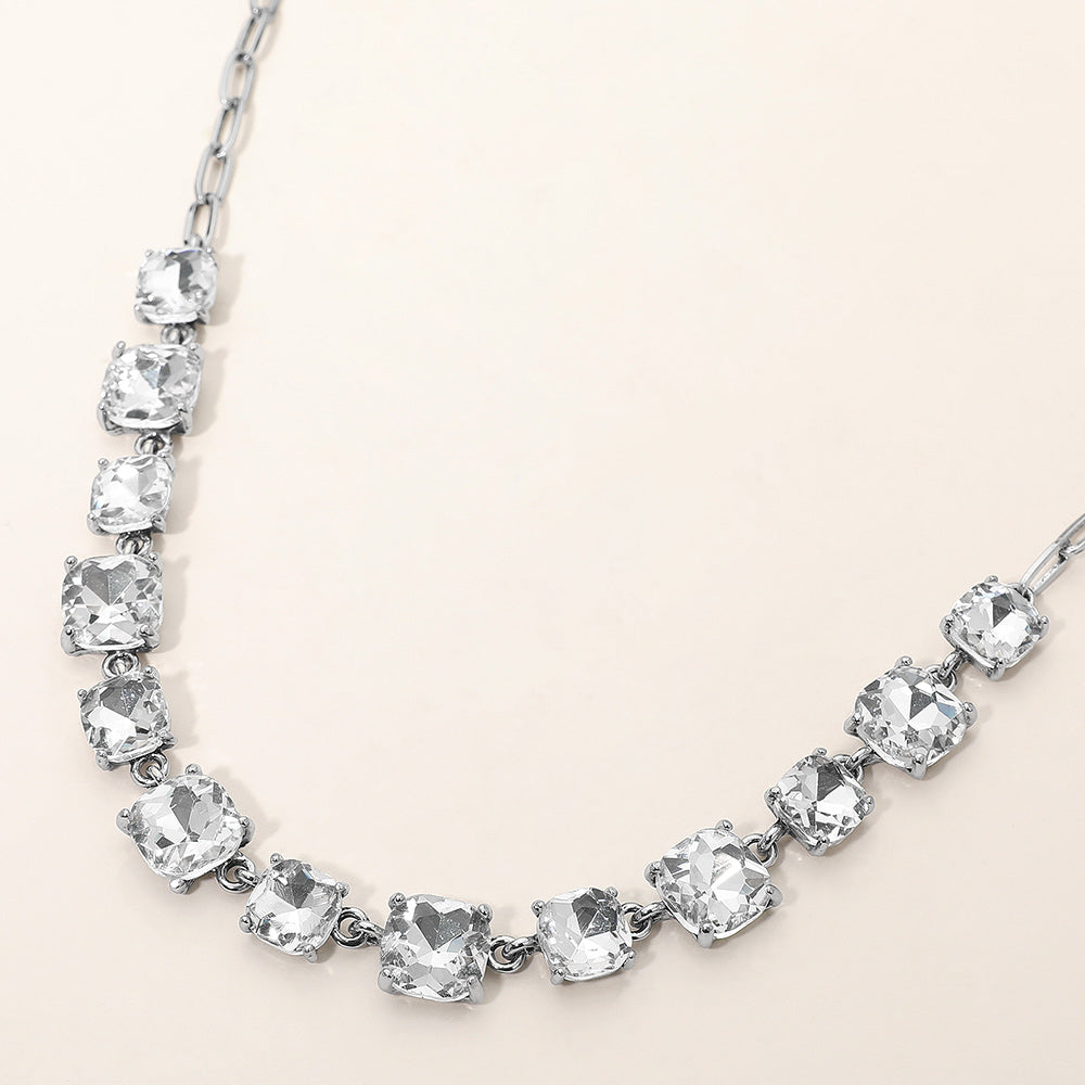 Clear Crystal Cushion Square Stone Link Pageant Necklace | Prom Necklace, antique silver backed, on a beige background. 