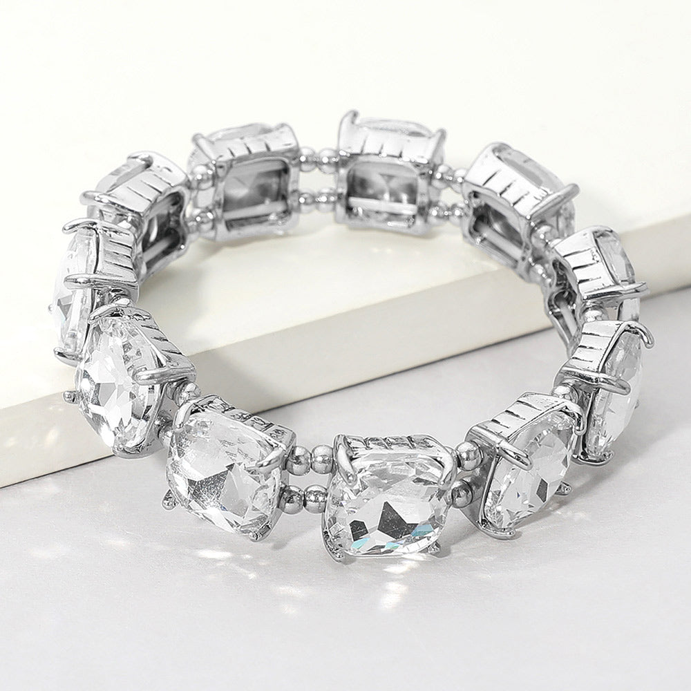  Clear cushion square stone stretch evening bracelet on silver, classic crystal bracelet on a white background