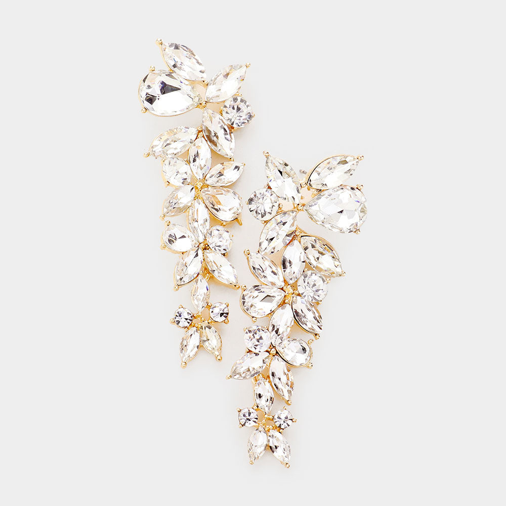 Clear crystal floral multi stone drop earrings on gold with layered cluster design, 3 inch statement earrings on a white background
