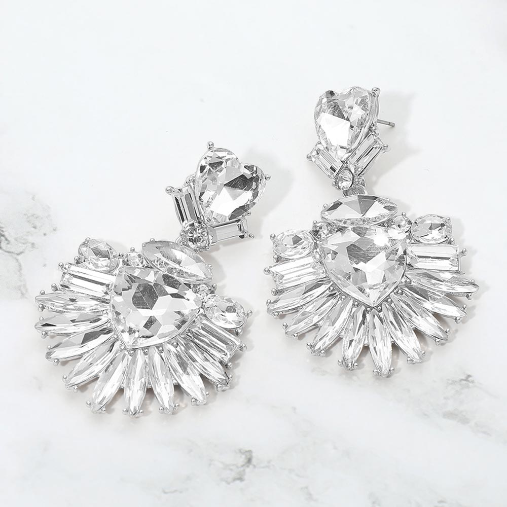 Clear Crystal Heart Crystal Fan pageant and prom earrings on silver displayed on a white marble background