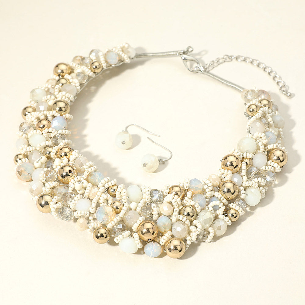 Clear ivory faceted beaded collar necklace set with matching earrings in a fun fashion style on a light background
