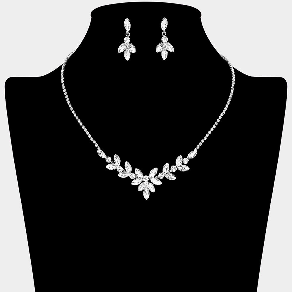 Clear crystal marquise leaf necklace and earring set on silver for formal events and pageants on a black mannequin bust on a white background.