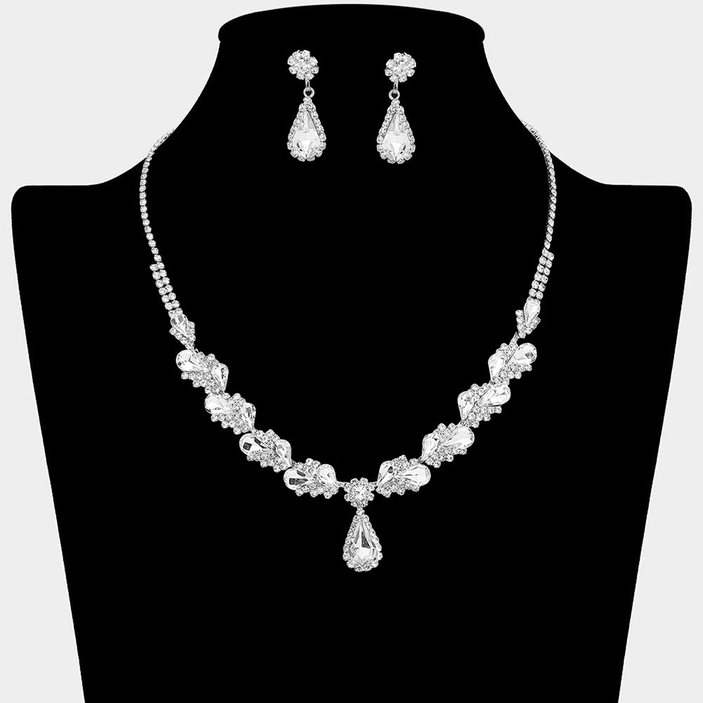 Clear marquise pendant necklace set on silver with matching earrings for prom and evening wear on a black mannequin bust on a white background.
