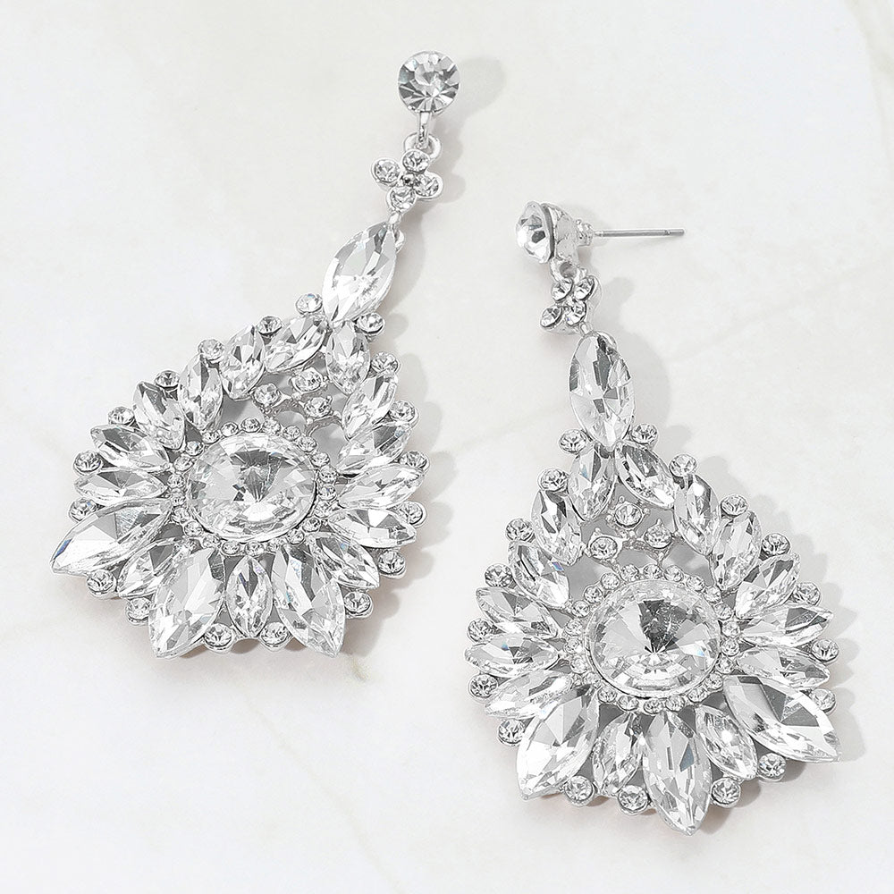 Clear marquise and round teardrop statement earrings on silver for bridal, prom, or pageant wear on a white background