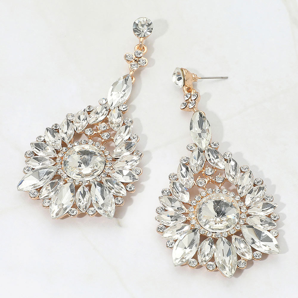 Clear marquise and round teardrop earrings on gold for bridal or prom evening wear on a white background