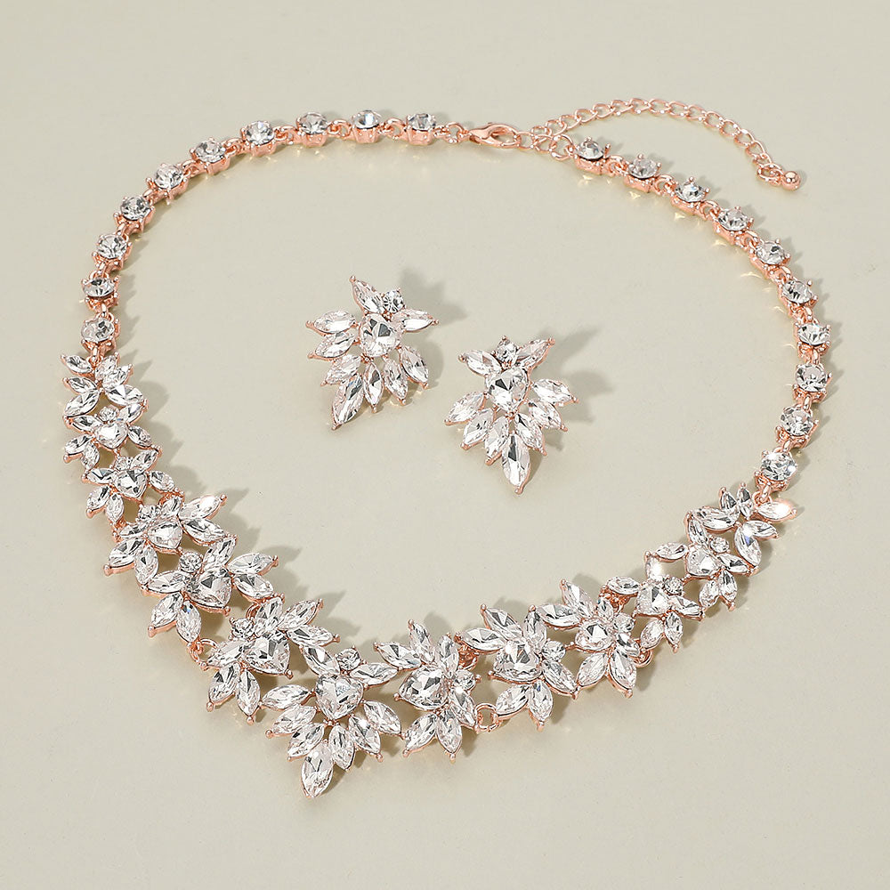 Clear marquise floral statement necklace set on rose gold on a beige background