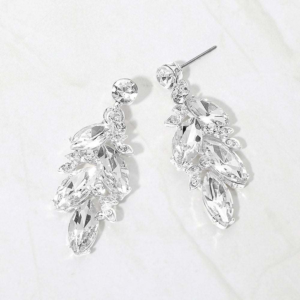 Clear marquise stone cluster leaf drop earrings on silver on white background