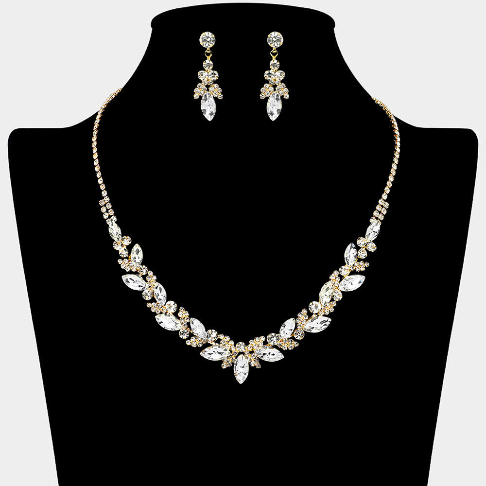 Clear marquise leaf rhinestone necklace set on gold displayed on black bust background