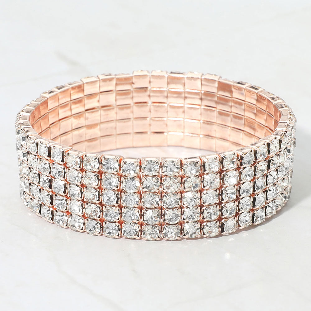 Clear multi-row crystal stretch bracelet on rose gold displayed on white background
