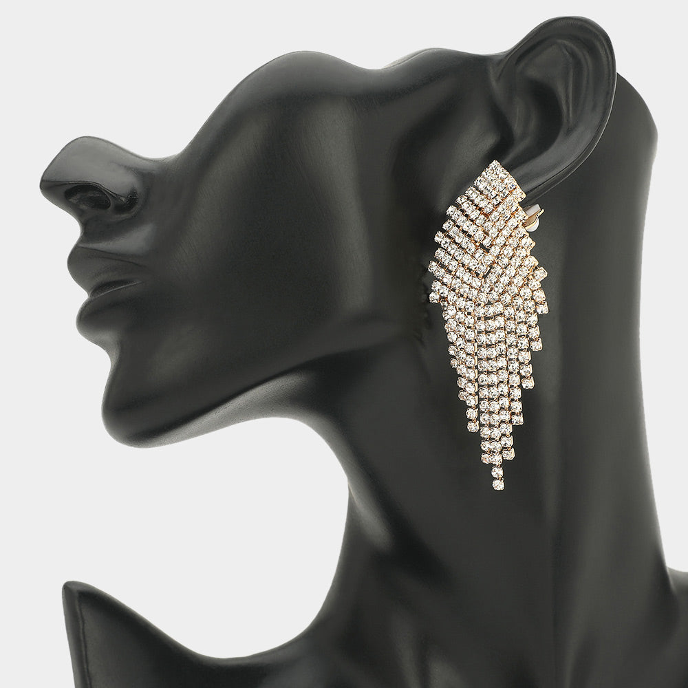 Clear crystal rhinestone fringe clip-on formal and pageant earrings on gold displayed on black mannequin ear