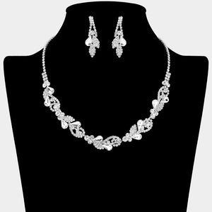 Clear rhinestone leaf cluster necklace set with teardrop crystal earrings, silver backed, for prom and evening wear on a black mannequin bust.