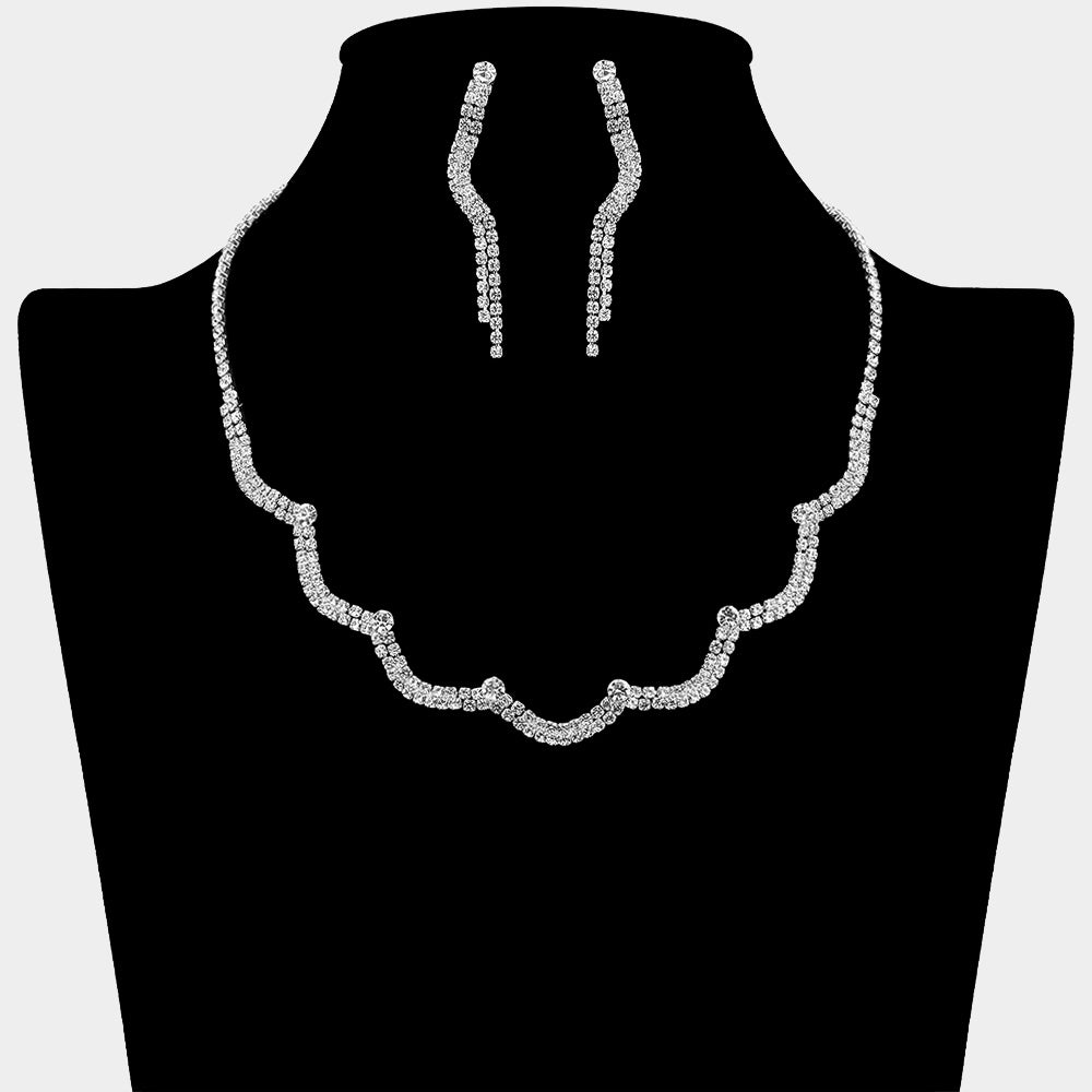 Clear on silver curved rhinestone necklace set with drop earrings for prom or bridal elegance on a black mannequin bust