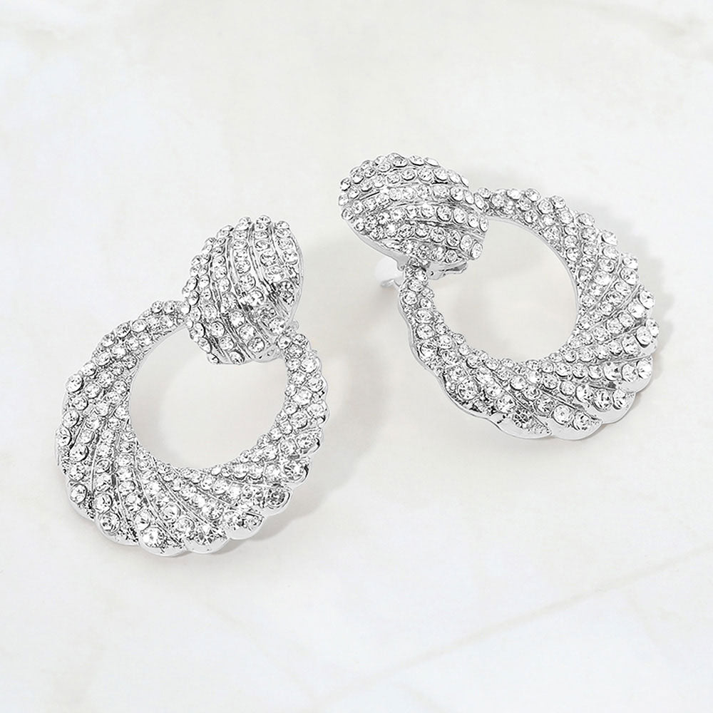 Clear rhinestone pavé door knocker clip-on earrings on a white background