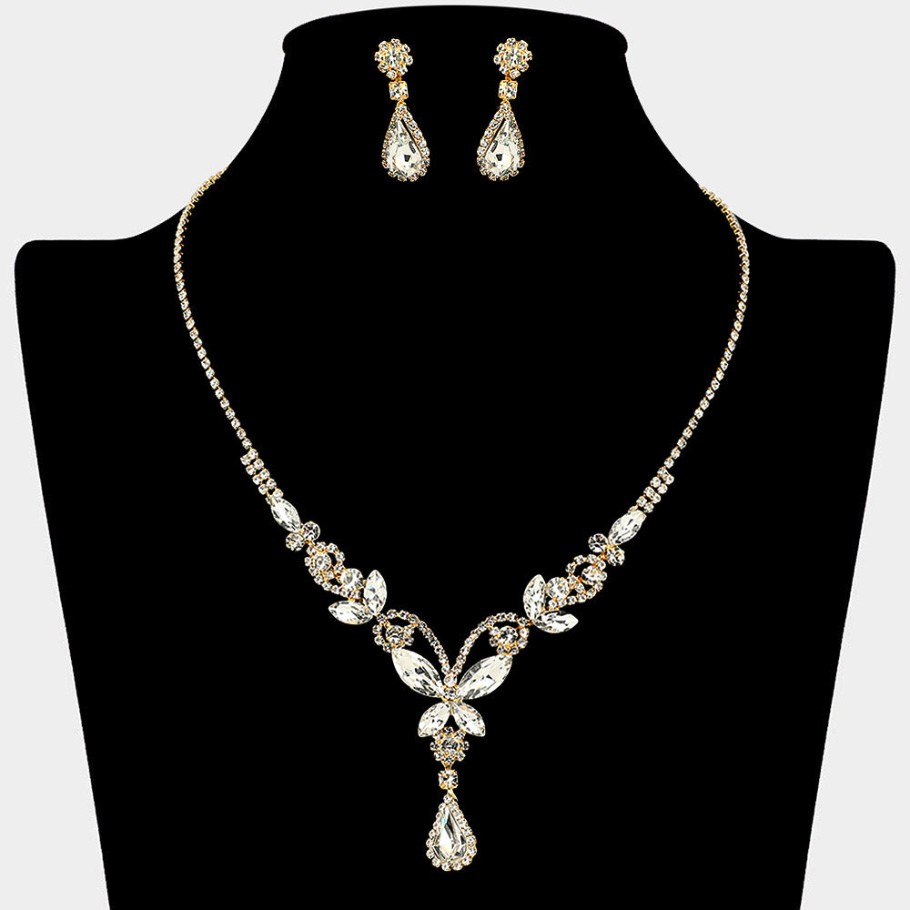 Clear teardrop butterfly rhinestone necklace set on gold displayed on black bust background