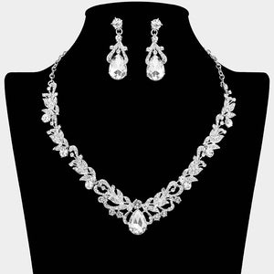 Clear teardrop leaf crystal statement necklace set with matching earrings in a silver setting, shown on a black mannequin bust on a white background