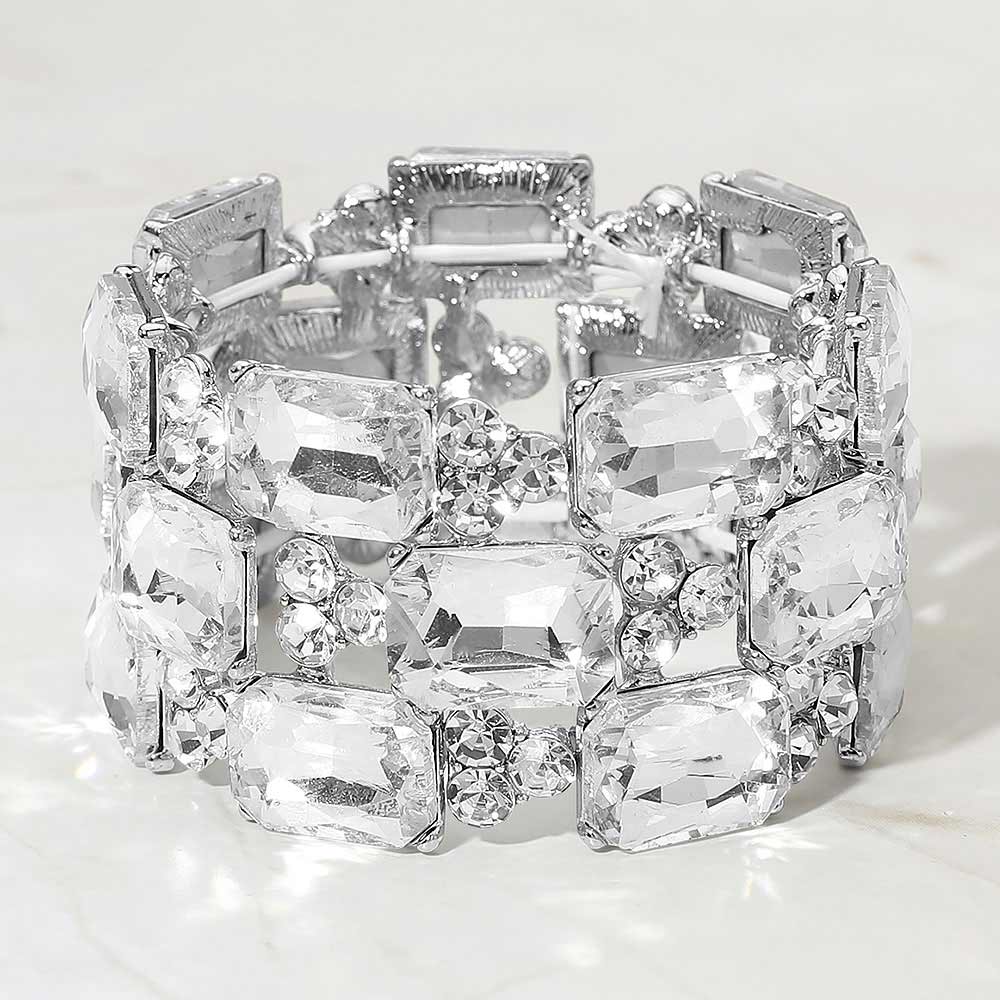 Clear wide emerald cut crystal stretch bracelet on silver on white background