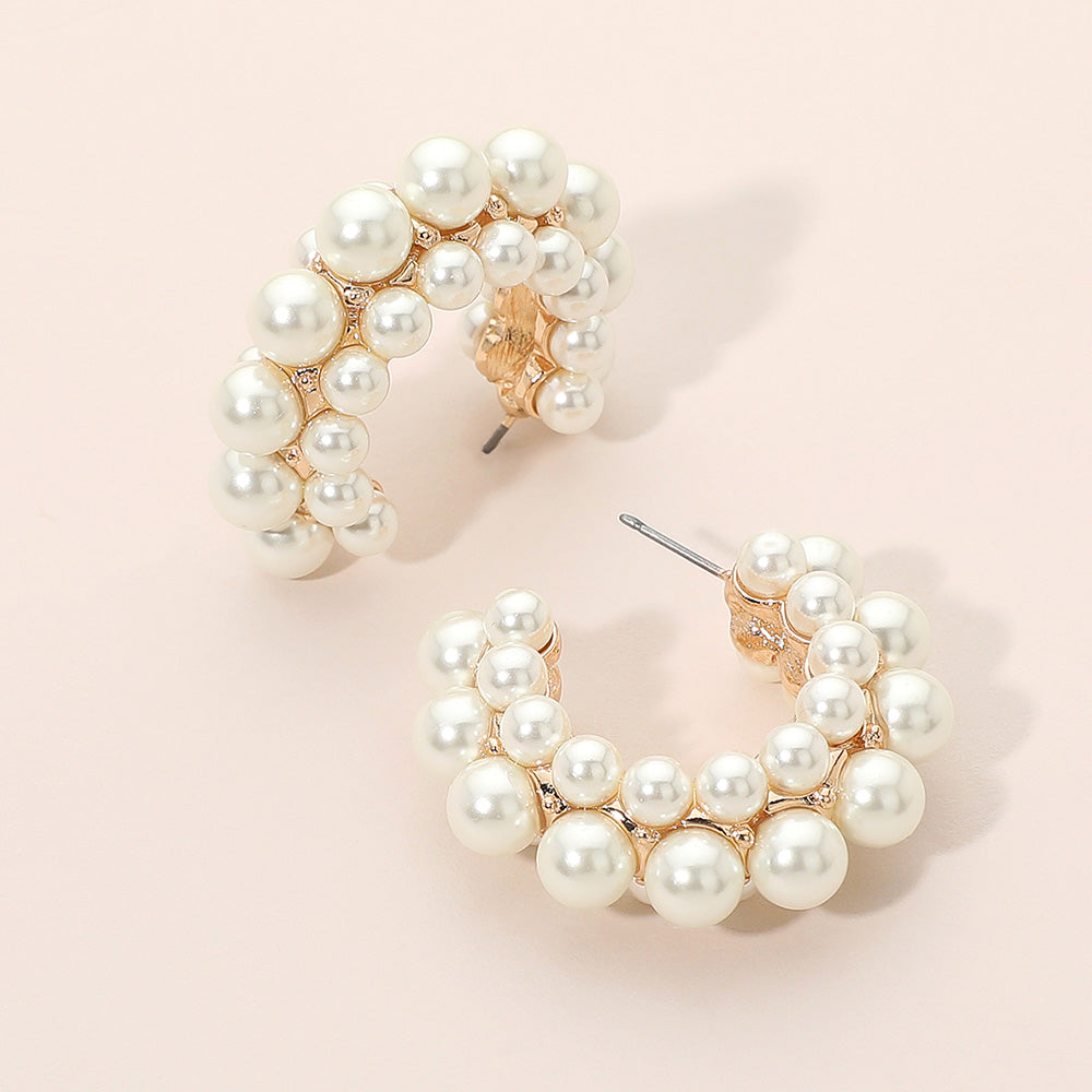Cream pearl cluster hoop earrings in a bridal-inspired statement style with gold setting