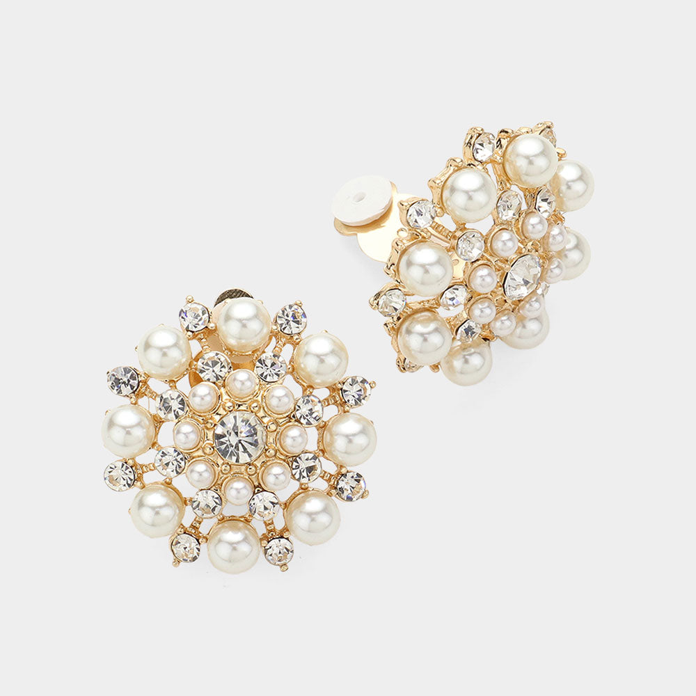 Cream pearl and crystal cluster clip-on earrings on gold with round floral design, 1.3 inch earrings on a white background