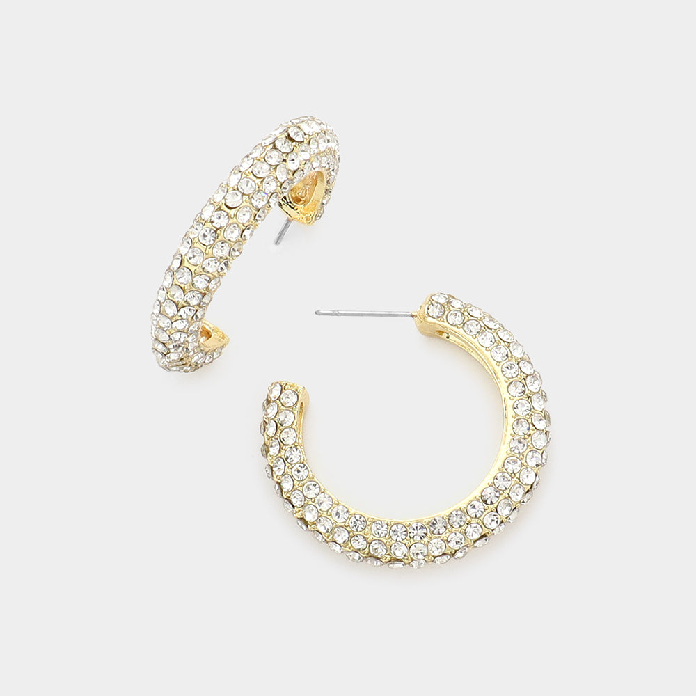 Crystal pavé open hoop earrings with clear rhinestones on a gold finish, displayed on a white background.