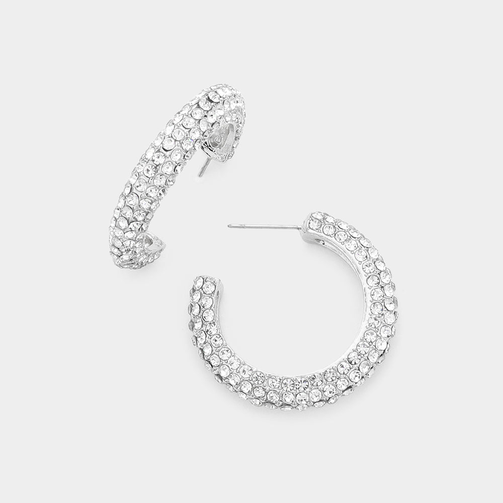 Crystal pavé open hoop earrings with clear rhinestones on a silver finish, displayed on a white background.