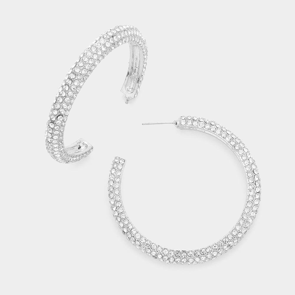 Crystal pavé open hoop earrings with clear rhinestones on a silver finish, displayed on a white background.