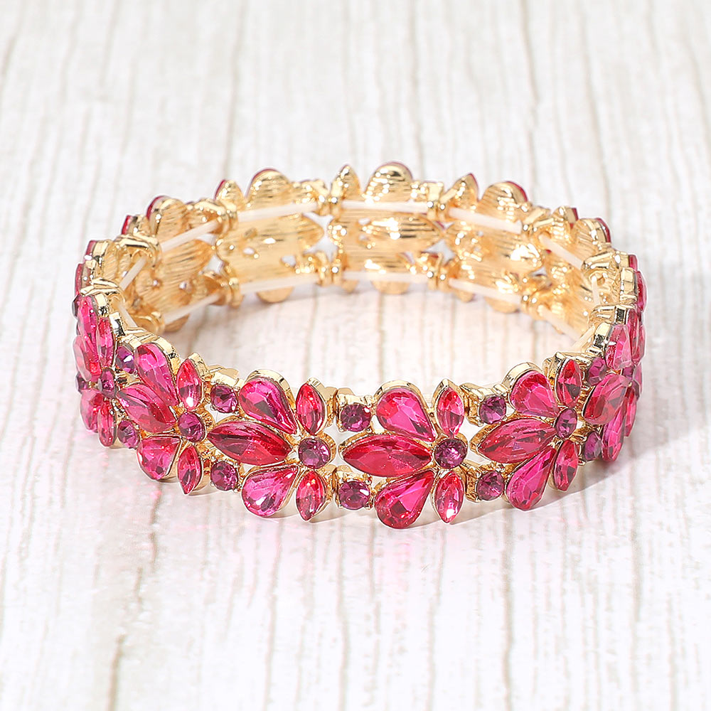 Fuchsia Crystal Flower Stretch Pageant Bracelet  | Prom Bracelet. Shown here on a wood grain background.