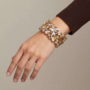 Champagne Gold Stone Crystal Marquise Stretch Statement Bracelet on Gold on a model's wrist.
