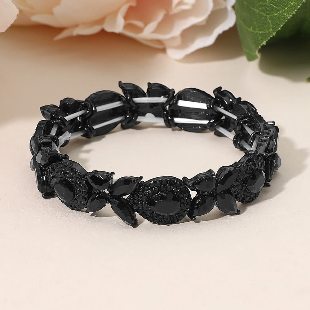 Black marquise rhinestone cluster stretch bracelet for pageants, homecoming, or formal events on a peach background