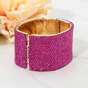 Back view of fuchsia wide rhinestone hinged bangle bracelet showing smooth interior and secure hinge closure
