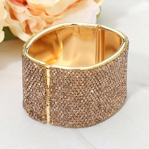 Back view of light topaz gold stone wide rhinestone hinged bangle bracelet showing smooth interior and secure hinge closure