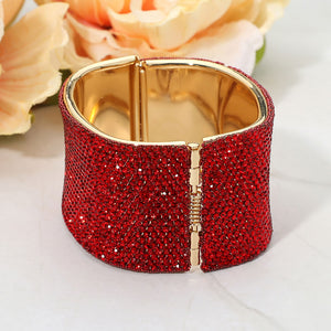 Back view of red wide rhinestone hinged bangle bracelet showing smooth interior and secure hinge closure