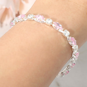 Clear & light pink marquise crystal prom bracelet on silver on a model's wrist