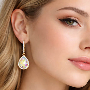 AB teardrop rhinestone trim dangle earrings on gold shown here on a model