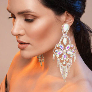 Very large AB crystal flower fringe pageant earrings on gold worn by model for pageant styling