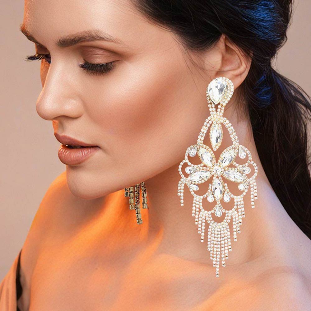 Very large clear crystal flower fringe pageant earrings on gold with 5.5 inch drop worn by model for pageant styling