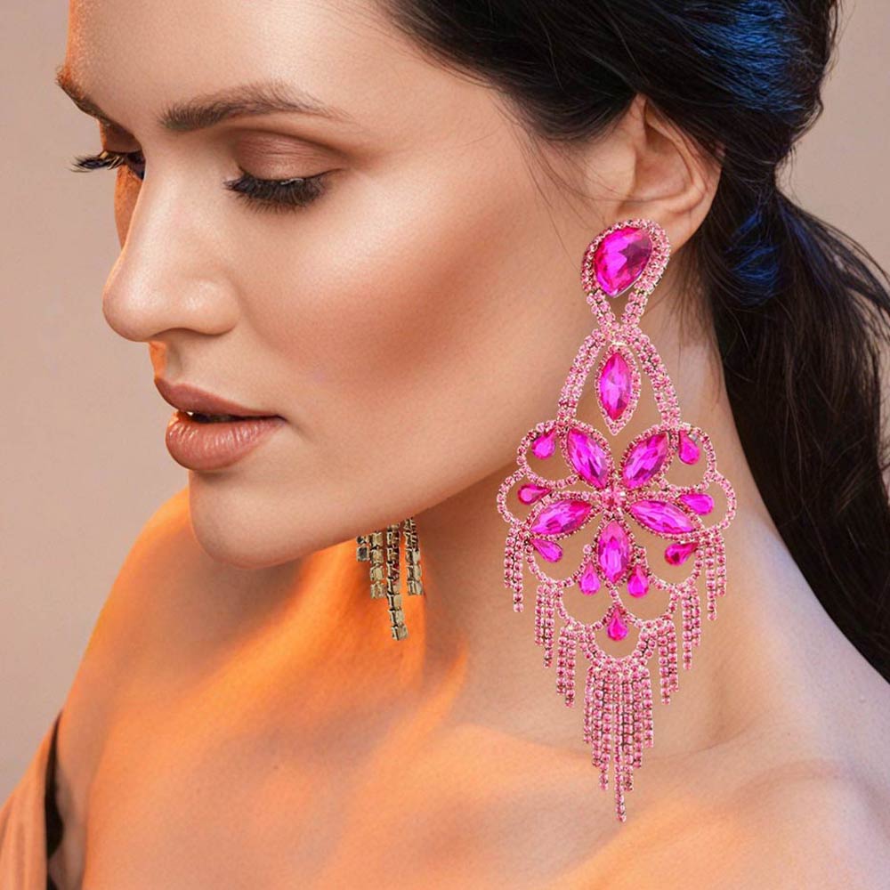 Very large fuchsia hot pink crystal flower fringe pageant earrings on gold worn by model for pageant styling