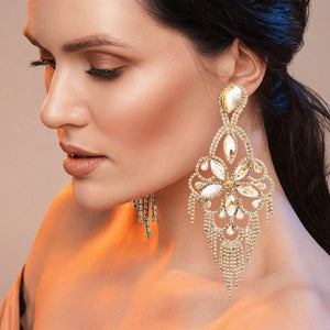 Very large topaz gold stone crystal flower fringe pageant earrings on gold worn by model for pageant styling