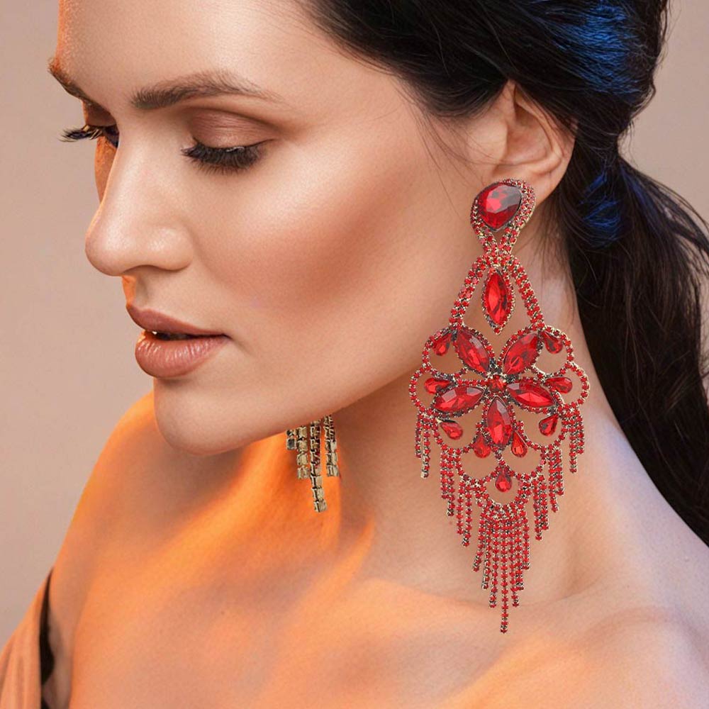 Very large red crystal flower fringe pageant earrings on gold worn by model for pageant styling