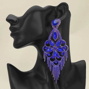 Very large royal blue sapphire crystal flower fringe pageant earrings on gold worn by model for pageant styling