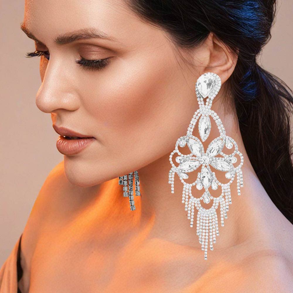 Very large clear crystal flower fringe pageant earrings on silver worn by model for pageant styling