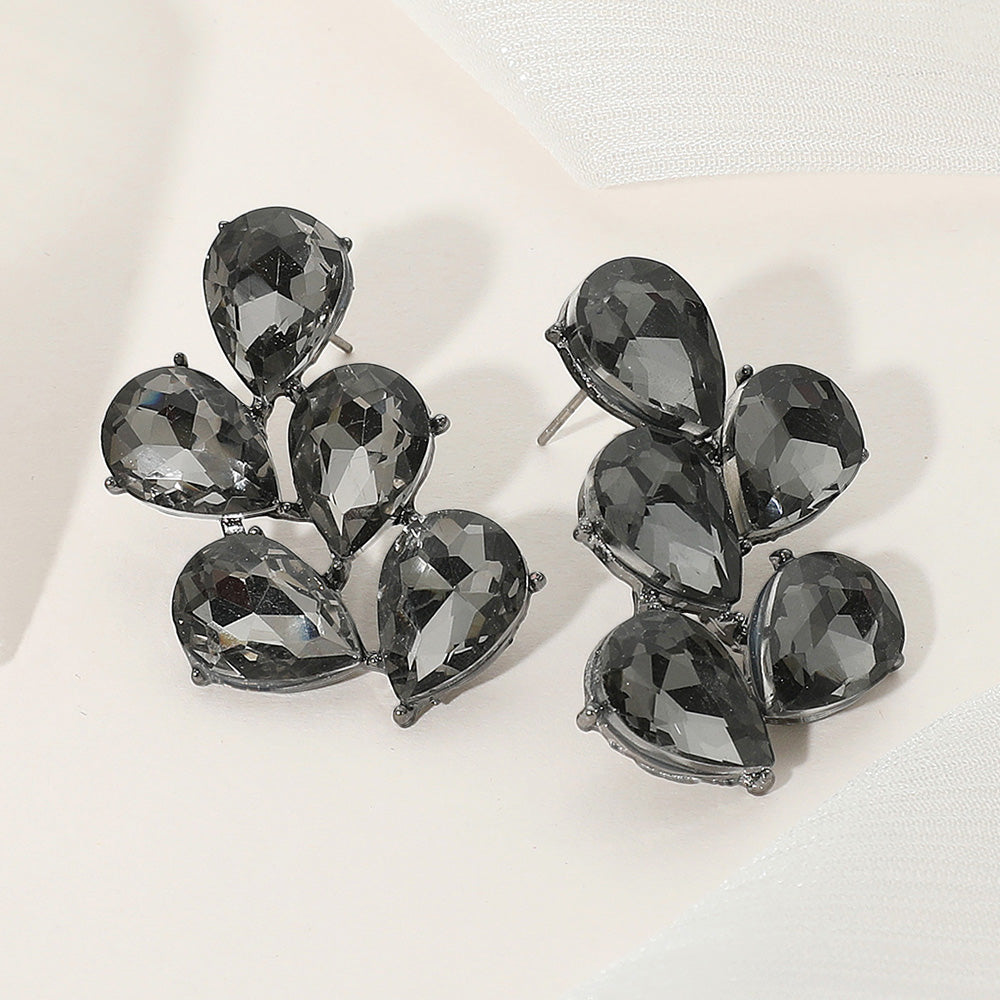 Black diamond teardrop cluster earrings for pageants, prom, or evening looks on a light background.