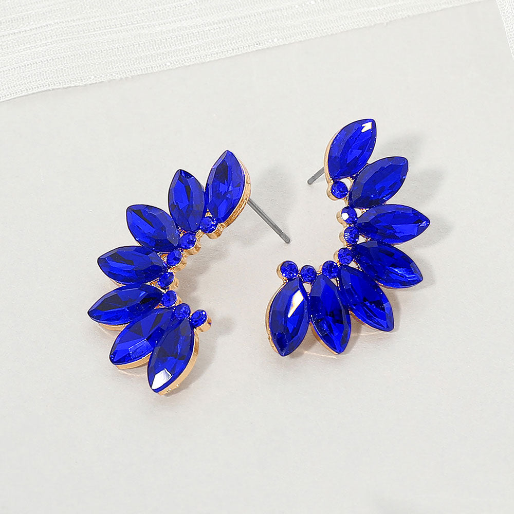Sapphire Royal Blue crystal marquise wing-inspired earrings on gold with layered marquise stones, displayed on a white background.